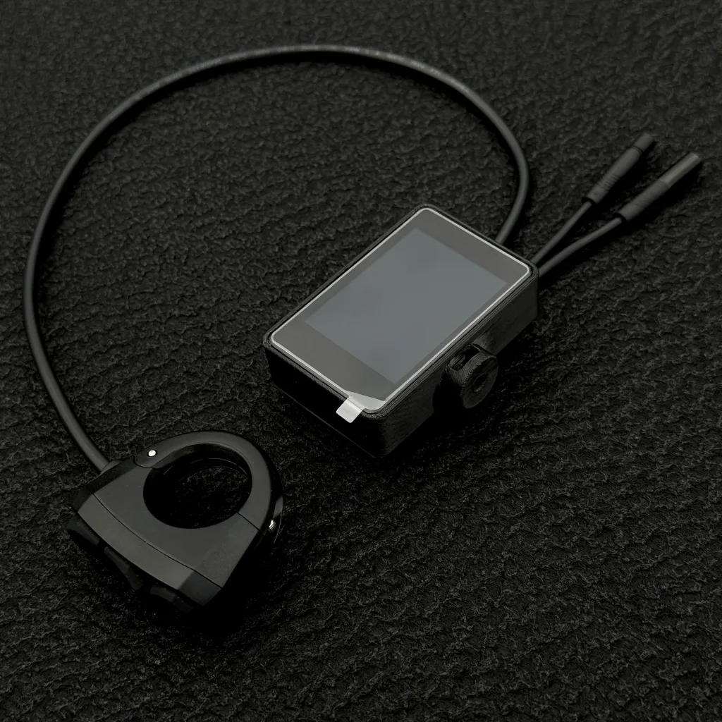 The FabiRide Dash Pro display with its bar bracket and controller leads